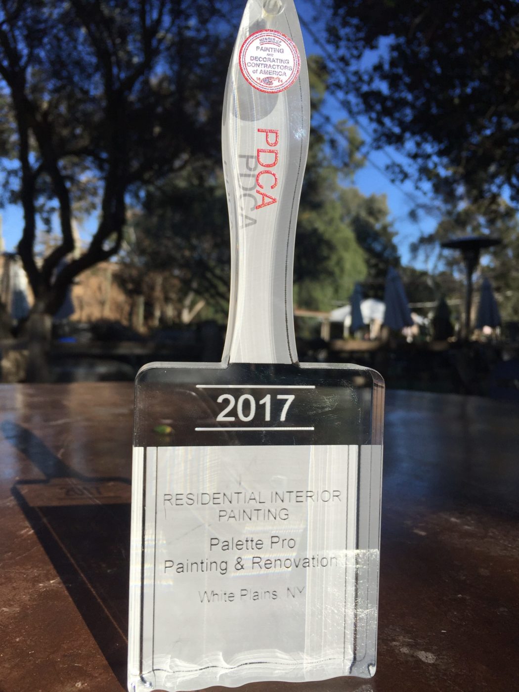 Glass paintbrush-shaped PDCA trophy for 2017 Residential Interior Painting, engraved with Palette Pro's name