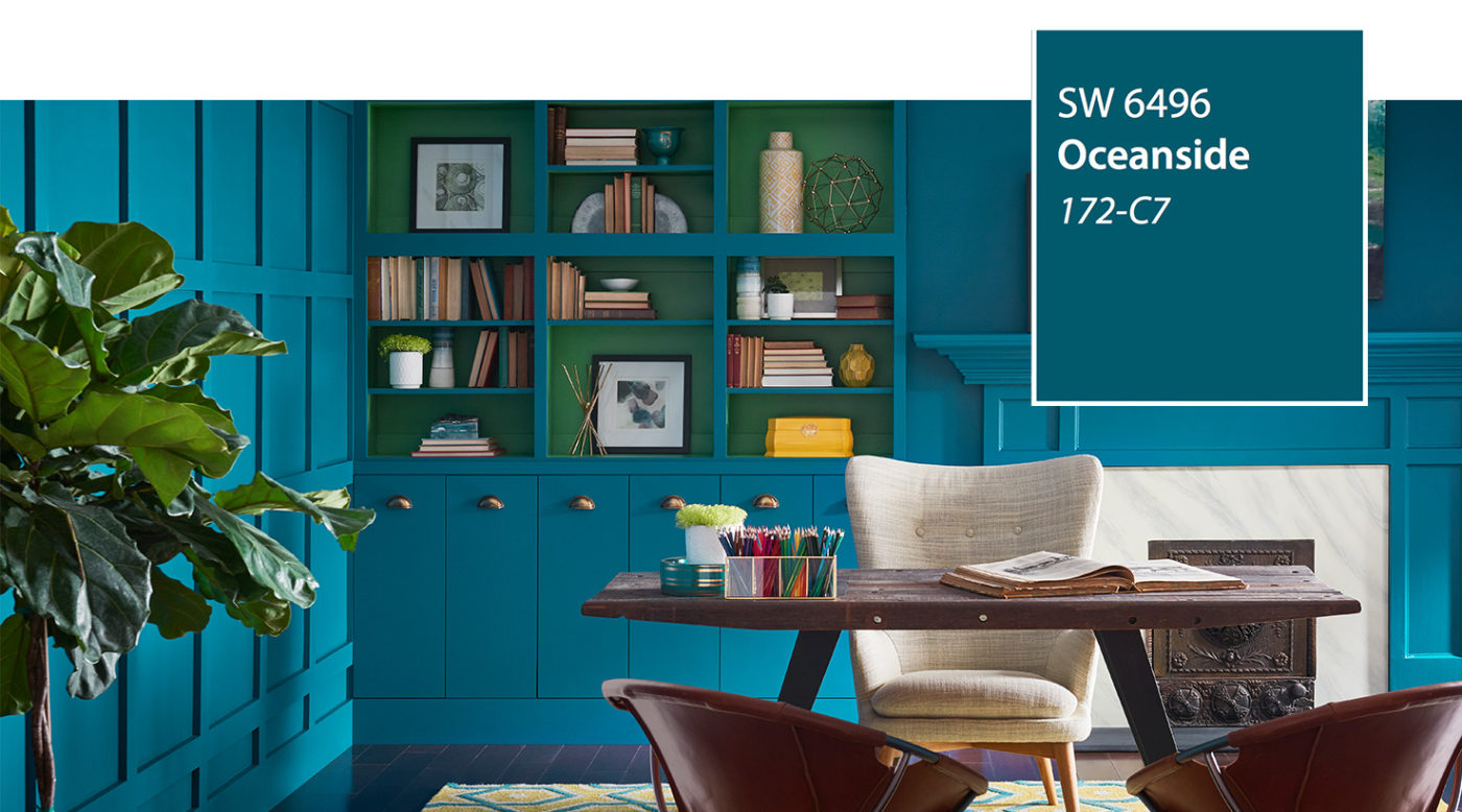 Built-in bookshelves and paneled walls in Sherwin-Williams 2018 color of the year, Oceanside SW 6496, a deep teal
