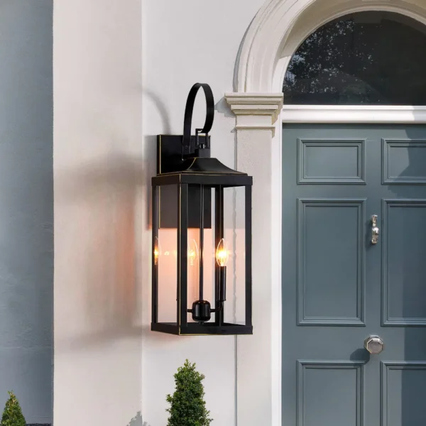 Black lantern wall light beside a slate blue paneled front door with white trim and an arched window above
